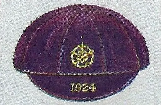 Vintage England national team football cap with crest and 1924 embroidery on collectible card.